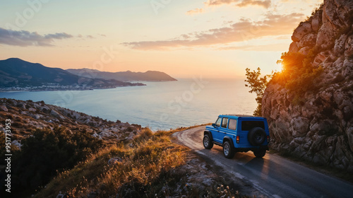 Blue SUV car drives along a coastal road at sunset with rocky cliffs and sea view. Travel and road trip concept