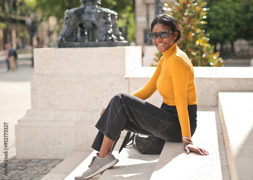 portrait of a young woman ona a stairs in the street