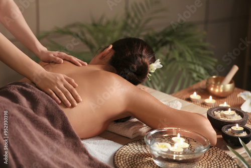 Beautiful woman receiving spa massage in salon