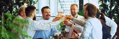 Cheers to successful project. Group of colleagues, business people, men clinking beer glasses, sitting at outdoor bar and celebrating good work. Concept of business, meeting, celebration, Oktoberfest