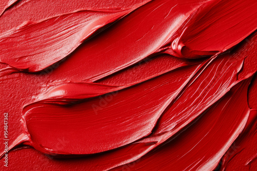 Macro shot of vibrant red lipstick smear glossy texture with visible brush strokes rich color depth 