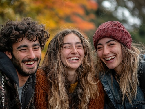 Friends laughing candidly together in a park enjoying each others company