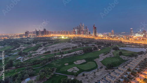 Dubai Marina skyscrapers and golf course night to day timelapse, Dubai, United Arab Emirates