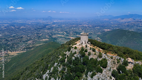 Aerial view of sperone tower dominating green irpinia valley, italy