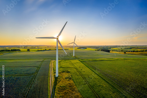 Wind turbines that produce electricity, built on a field in Skanderborg, Denmark