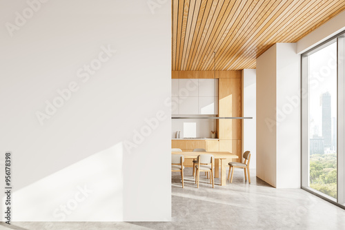 Home kitchen interior with cooking cabinet and dinner table, window. Mockup wall