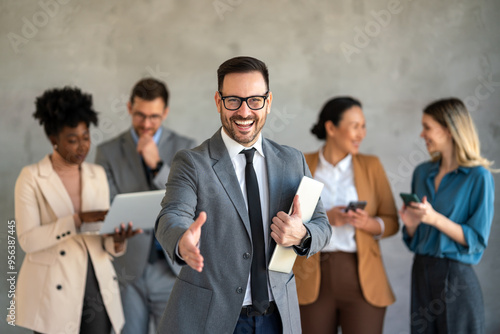 Portrait of successful group of business people at office. Multiethnic group of people smiling.