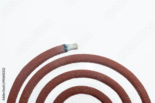 A mosquito coil with smoke coming out of it