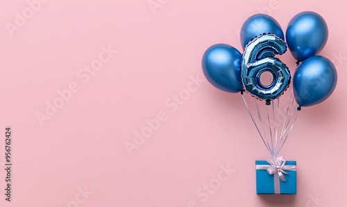 Happy birthday 6th with blue foil balloons and gift box on color background