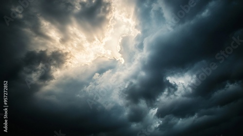 Dark clouds with the sun breaking through, stormy weather, dramatic lighting