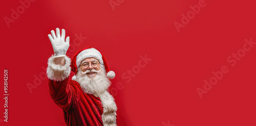 santa claus waving hello - red background