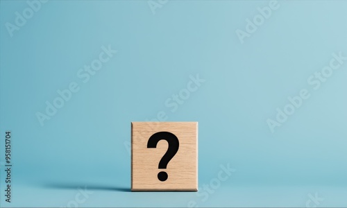 Question mark on wooden block against blue background