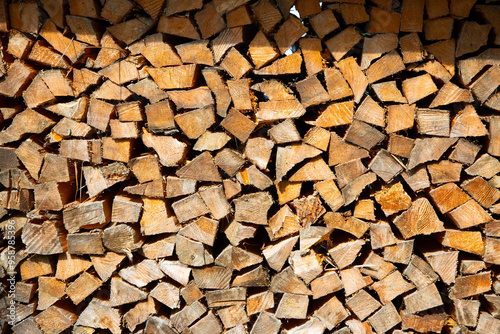 a stack of chopped firewood in alps