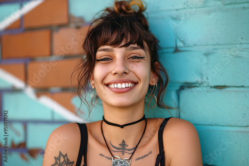 Young woman with a septum piercing smiling confidently, showcasing her unique jewelry in a trendy urban setting.