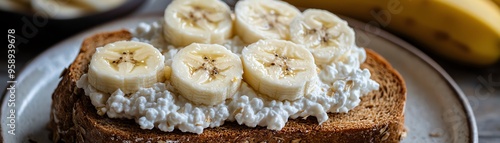 Healthy bread topped with creamy cottage cheese and fresh banana slices, perfect for breakfast or a snack.