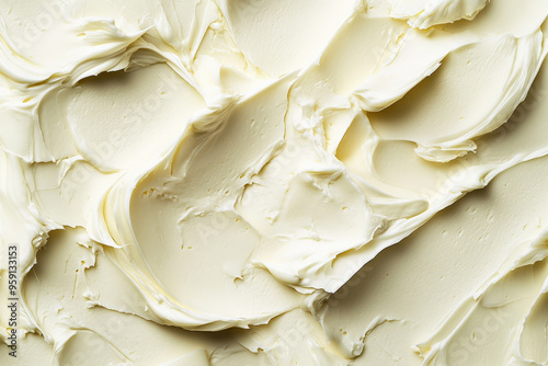 A light buttercream surface with a smooth, glossy texture. The warm, creamy tone and sleek texture add a luxurious and inviting feel to the background.