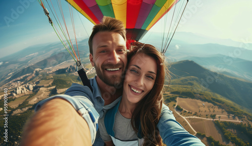 European couple in a hot air balloon in nature. Hot air balloon ride over mountains. Happy couple on a vacation holiday honeymoon date engagement excursion trip. Italian Spanish German Mediterranean 