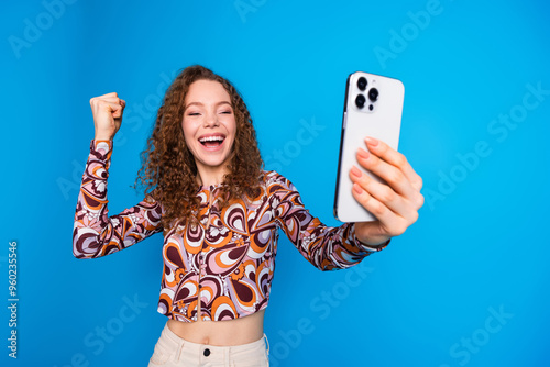 Photo portrait of lovely young lady take selfie photo winning dressed stylish colorful garment isolated on blue color background