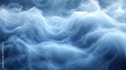 Misty blue wisps of vapor undulate gracefully in a serene and tranquil atmosphere evoking a sense of calm in the early morning light