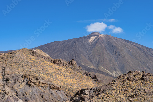 Famous El Teide volcano on the Tenerife island under the clouds during summer season