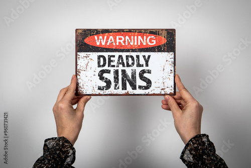 Deadly Sins. Warning sign with text on a white background