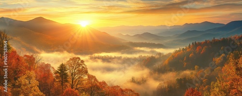 Majestic autumn sunrise over the Great Smoky Mountains with vibrant fall foliage and misty valleys