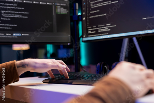 Developer typing code on computer to futureproof company network from downtimes and unexpected system failures. Man deploying programming script increasing data security, close up shot