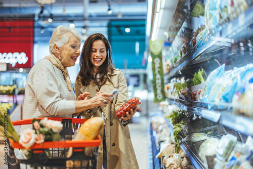 Smiling Women Shopping Together in a Grocery Store Aisle