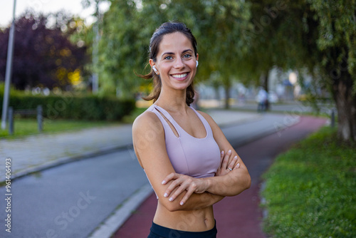 Confident Woman Smiling Outdoors in Athletic Wear