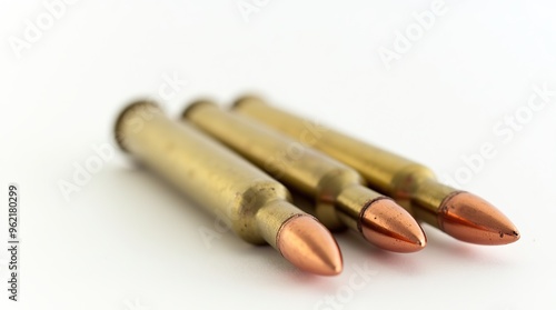 Rifle ammunition on white background with close-up focus on bullets