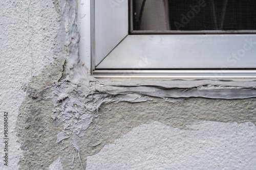 Close up of an uncomplete sealant window corner. The work is not done properly.