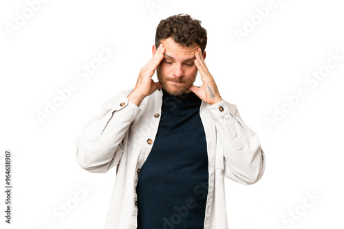 Brazilian man over isolated chroma key background with headache