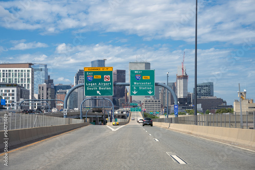 Road signs at an interstate highway for directions and arrows to Boston, New Haven and Springfield.