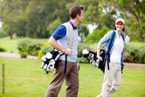 Couple, happy and golf course for sports, bonding and relationship together with equipment bag. Man, woman and walking on grass or lawn for game, hobby and love with conversation at country club