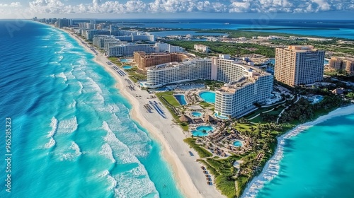 Captivating bird's-eye view of a luxurious resort area and the immaculate sandy beaches bordering the turquoise waters of the Gulf of Mexico in Cancun.