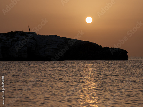 Beautiful sunrise over the Adriatic Sea and Campi island. Baia and Cala Campi, Vieste, Gargano National Park. Italy