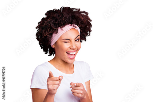 Close up photo beautiful amazing funny she her dark skin winking eyes positive friendly indicating fingers your turn its you symbol wear head scarf casual white t-shirt isolated pink bright background