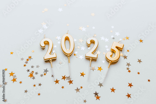 Golden candles with numbers 2025 new year celebration 