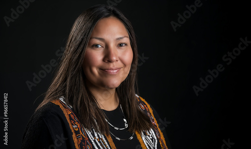 Portrait of a Native American Indian woman on a black background