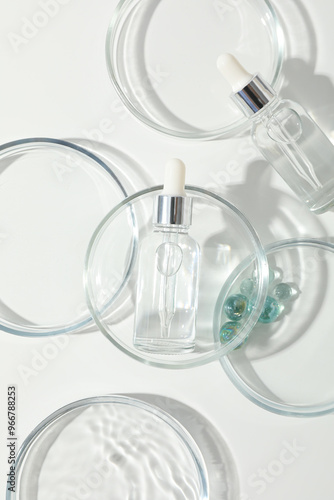 Transparent cosmetic bottles on a white background