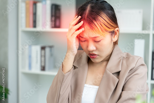 Headache, female having migraine pain, bad health, Asian woman feeling stress and headache, Office syndrome, sad tired touching forehead having migraine or depression, irritated girl, sadness grief