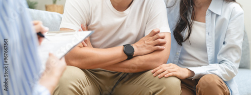 psychologist talking with a couple during mental therapy.