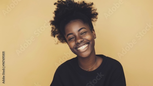 Radiant smile portrait with a warm, golden background, capturing genuine happiness and vibrant energy.