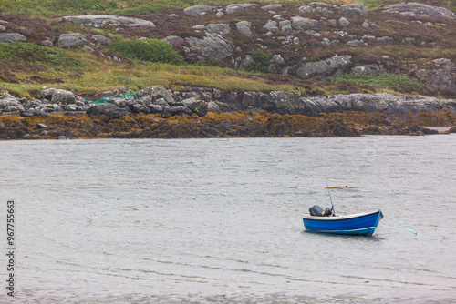 Small boat in a bay in South Uist, Image shows a bay protected from the elements along the South Uist coastline