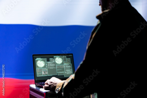 KGB soviet agent relaying surveillance data, standing isolated over Russian federation flag background. Incognito intelligence operative completes annexation special operation