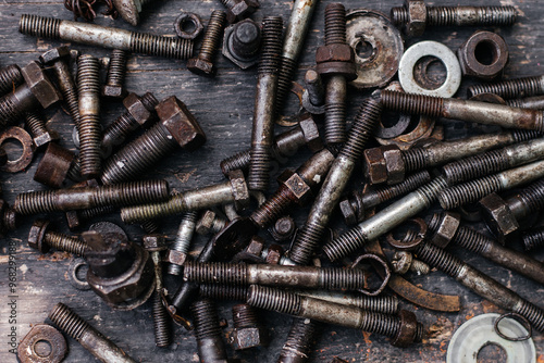 Background image of old nuts and bolts in mazut