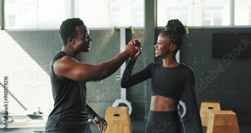 Break, fitness and high five with black people in gym for challenge, sports training or workout. Smile, success or support with athlete and person trainer in health club for exercise goals or target