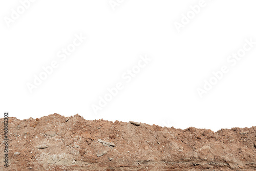 A long pile of brown-orange colored soil. On isolated white background with clipping path.