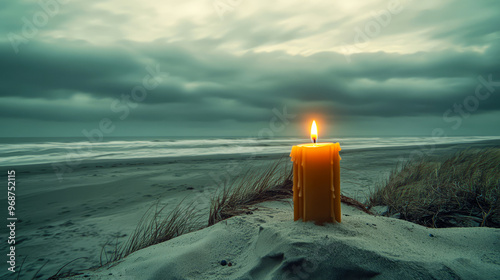 A Single Candle Burning On A Sandy Beach With Stormy Seas In The Background. Hope In The Face Of Adversity.