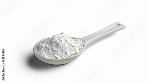 A spoonful of white powder is shown on a white background